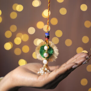 Mukta Prem Pearl Loomba Cum Pendant Rakhi