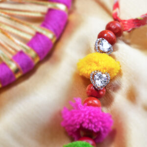 Manhar Loomba cum Earrings Rakhi