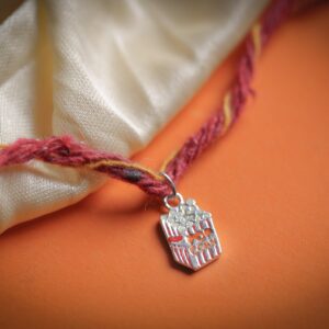Cute Popcorn Rakhi cum Charm for kids